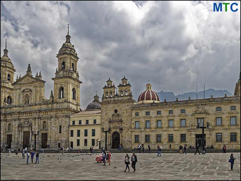 People walking around Bogota Cathedral Colombia